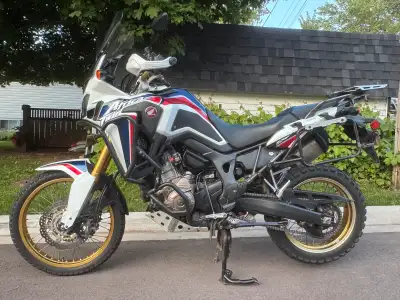 Honda Africa Twin 1000cc manual shift adventure bike. Extras include hand warmers, tall windshield,...
