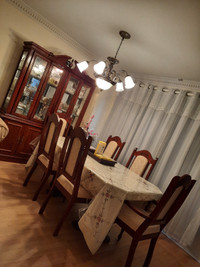 SOLID WOOD dining table with 6 chairs.  There's a hutch as well.