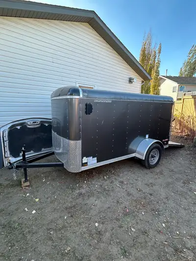 Grey single axle enclosed trailer. Reason for selling, sold dirtbikes and toys. Great little unit wi...