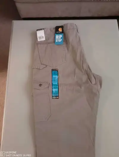 New with tags Men's CARHARTT DOUBLE KNEE RIPSTOP WORK PANTS. SIZE 42 X 32 . Cut resistant cargo work...