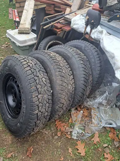 235 85 16 snow tires on steel wheels,bought them last year they was supposed to fit a dodge truck bu...