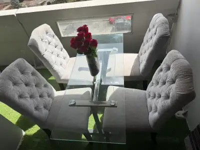 Dining table with four chairs in great condition, View more