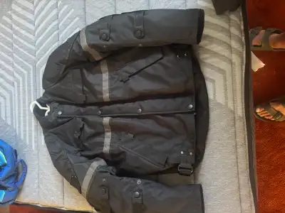100% Waterproof has padding in the arms and in the back comes with pants that are size 36 with snapp...