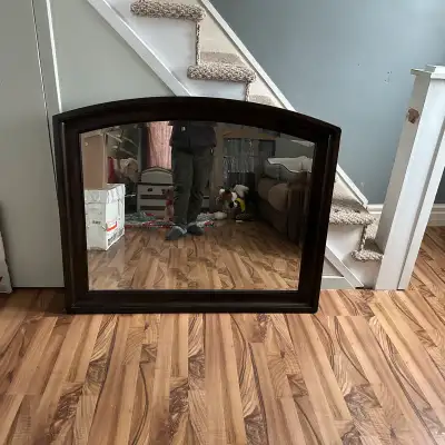 Dark brown large mirror in perfect condition was used on my dresser. Mirror doesn't fit in my space...