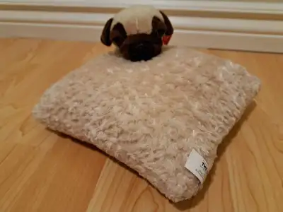 Adorable plush pug dog on a small fluffy pillow. Part of the McDonalds Happy Meal toy collection. Pe...