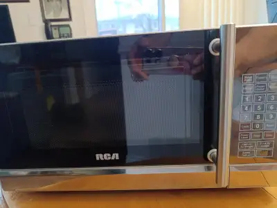 LIKE NEW - STAINLESS STEEL MEDIUM SIZE MICROWAVE, View more