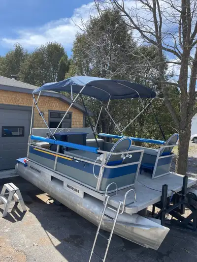 Pontoon boat with 15HP 4 stroke Mercury outboard and trailer fully ready to go, PFD's and all safety...