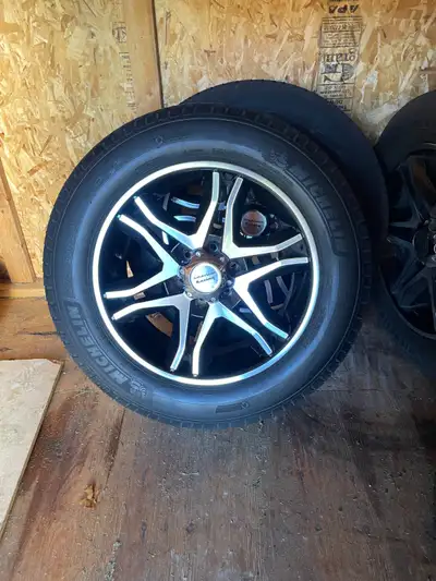 Selling four Michelin tires mounted on 20inch American racing rims. Includes 24 chrome lug nuts. Tre...