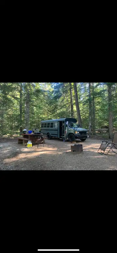 2002 Ford E350 7.3 Litre diesel. With a wood burning stove and queen bed. Runs and drives. New tires...