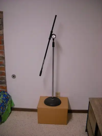 Old school chrome microphone stand with black boom arm. West side pickup.