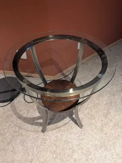 23.5x23.5x 25 tall two glass end tables in good condition. Have auction cups so glass doesn't move a...
