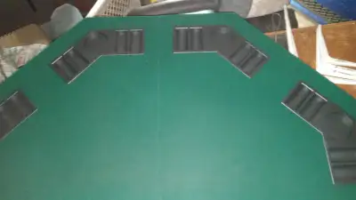 Poker table with a case of poker chips, View more