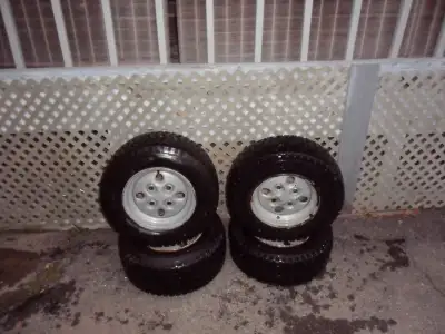 Deestone tubeless tires(80% tread).. no plugs rims are 4 bolt pattern(3 and 1/4" apart).. 2 of 23"X9...
