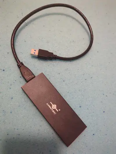 Includes housing, cable and 256GB storage module. Like new