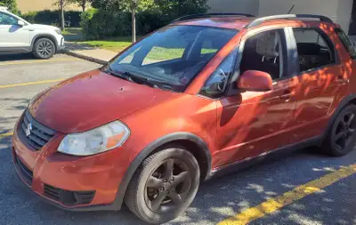 Suzuki SX4 couleur bronze 2013 Moteur: 2.0L Kilomètrage: 124500 Km Transmission : automatique Air cl...