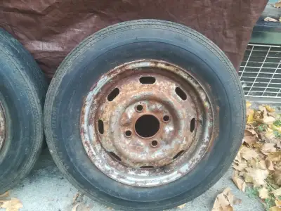 Selling 2 old Volkswagen beetle rims and tires. Both rims are a bit rusty from being in the shed but...