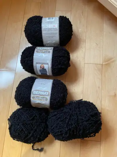 4 1/2 balls black .. 5 oz. 140 g Machine washable and dryable Soft acrylic 2 percent polyester