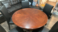 48” solid round dinning table with 5 new bonded leather chairs