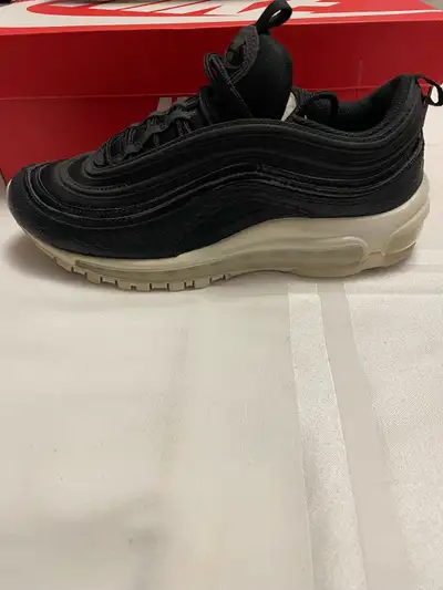 Selling a pair of women’s NIKE AIR MAX 97’S size 8 and in excellent condition. Black on white as see...