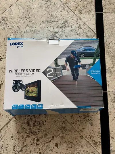 This is a Lorex by FLIR wireless video security system, model LW2762H. It features a 4-channel 7" LC...