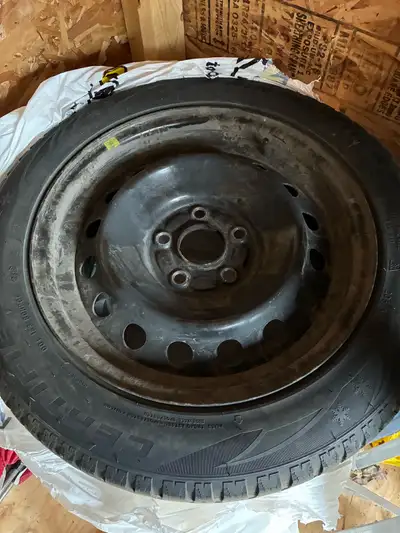 4 OEM Honda rims, still on studded tires, but tires are worn down and should be replaced. Only used...