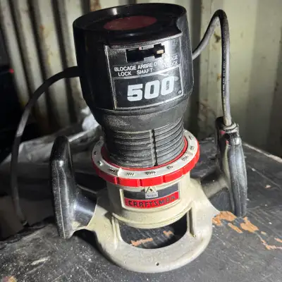 This is a Craftsman 500 router, perfect for your woodworking needs! This router has some signs of us...