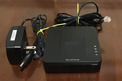 The Cisco SPA122 is an Analog Telephone Adapter (ATA) with 2 FXS, 1 10/100 WAN and 1 10/100 LAN port...