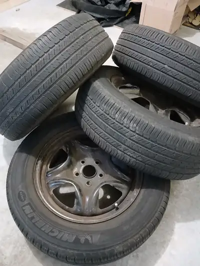 All season tires on steel rims; good condition; size 225 65R17 taken from RAV4; center bore 60.1mm;...
