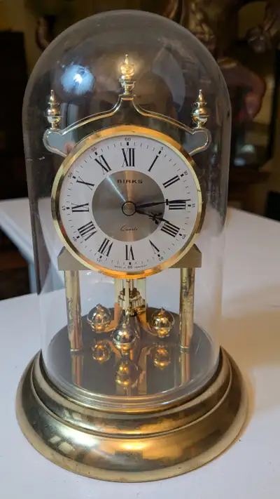 Vintage Birks Brass Clock featuring a rotating pendulum with glass dome. BATTERY INCLUDED. 7" Height