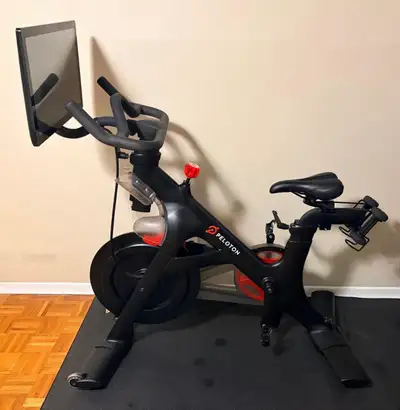 Bring the studio experience home with this Peloton Bike (Generation 1.2). Well-maintained, lightly u...