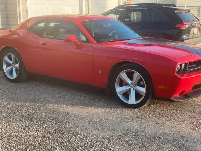 2010 Dodge Challenger SRT 8. 49000 original kms. 6.1L Hemi, auto. Excellent condition. Moving and ha...