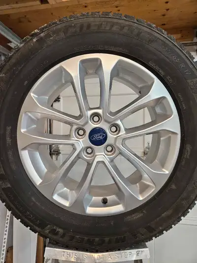 In great condition. No issues. OEM Ford 17" wheels with TPMS sensors and Michelin X-Ice Snow tires 2...