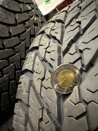 225/65R17x4 winter tires on rims.