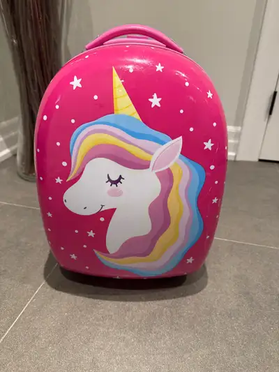 This adorable pink kids' rolling luggage features a fun unicorn design and is perfect for little tra...