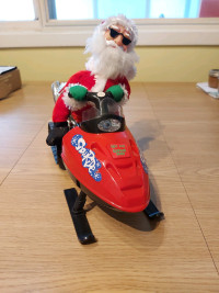 Santa snowmobiling figure