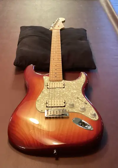 This American Stratocaster is in like new condition. No nicks or marks, neck is straight with no buz...