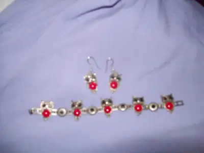 Jewelry sets, NEVER WORN . 1 Pewter OWLS with red and Black stones, Earrings, Necklace, and Bracelet...