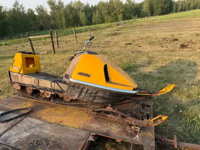 Offering a vintage 1969 Bombardier snowmobile with a Rotax 399cc engine. This classic machine shows...
