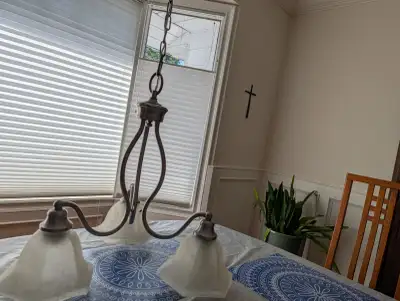 A simple three light chandelier., View more