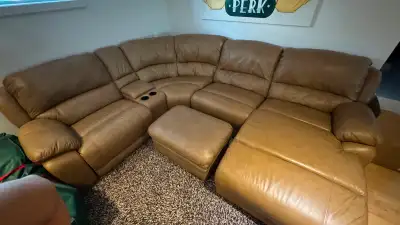 Moving sale!  This luxurious caramel leather sectional from the Cindy Crawford Home collection was o...