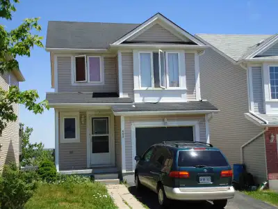 This lovely home has an open concept main floor kitchen / dinette / living room with a walkout deck...