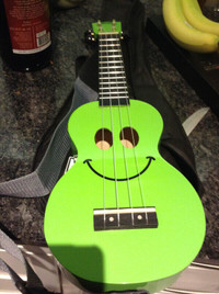 Perfect condition Ukulele with strap and case for sale