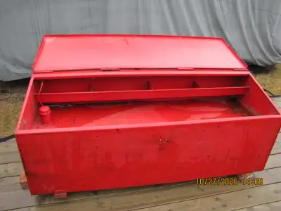 Fuel tank was custom built with storage area above tank. Good for tools, chains, tie downs, etc. Uni...