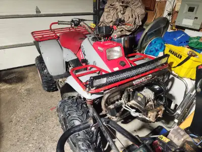 Hi it a 1993 polaris trail boss 350l 4x4 4 wheel drive on demand 2 stroke rebuild carburetor new reg...