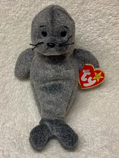 Ty SLIPPERY the Seal is a mottled grey with black button eyes and a black nose and black stitched ey...