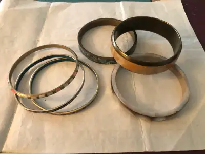 A fine group of 6 bangels with assorted inserts. Brass ,Copper all in good condition