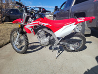 Like new 2021 Honda  CRF125 for sale. Less than 20 hrs   $4150