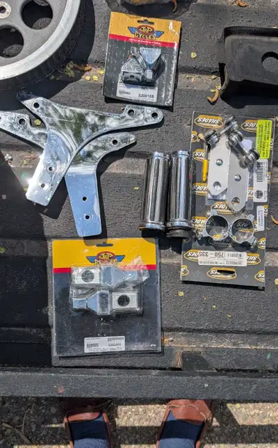 Selling different Harley models parts with some being brand new (headlight, handlebar grips, axle ad...