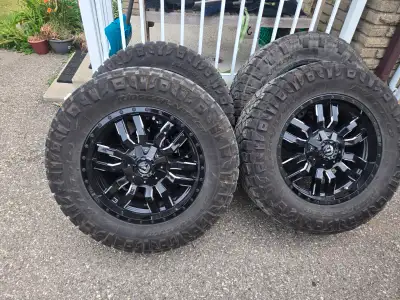20" fuel rims 6 bolt or 8 bolt chevy gmc pattern with 35" nitto grappler tires tires alone were 770$...