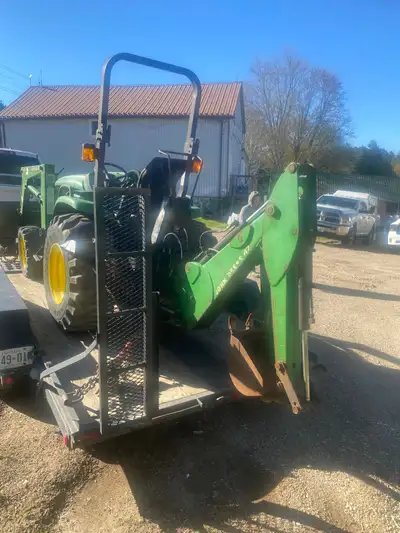John Deere 4400 tractor with backhoe and loader Hydrostatic drive Hour meter doesn’t work Quick atta...